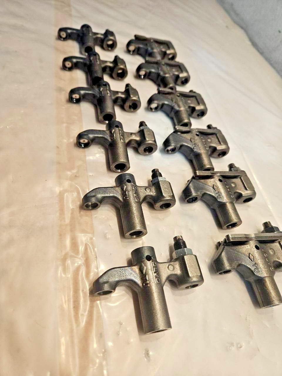 SET OF 12 VOLVO  D12 Diesel Engine VALVE BRIDGE 1638074 and 1547920 OEM - 135$ Picture 1 of 4 Picture 2 of 4 Picture 3 of 4 Picture 4 of 4